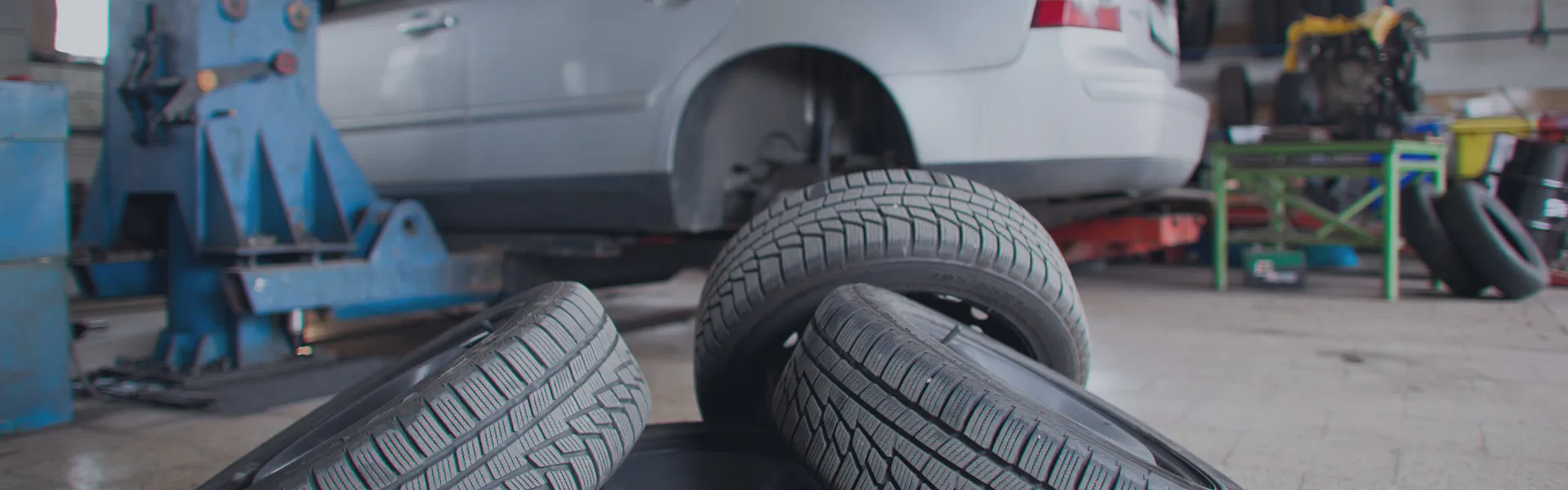 New tires stacked in an auto shop
